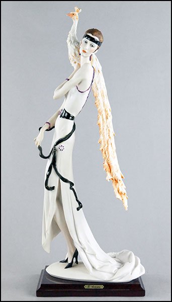 GIUSEPPE ARMANI FIGURE OF A LADY WITH A PEACOCK.: GIUSEPPE ARMANI FIGURE OF A LADY WITH A PEACOCK. Mounted on a wood base, bearing the artist's signature and the Capodimonte mark 20" x 7.5" x 5"