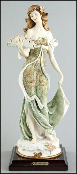 GIUSEPPE ARMANI FIGURE OF A LADY WITH FLOWERS.: GIUSEPPE ARMANI FIGURE OF A LADY WITH FLOWERS. Mounted on a wood base, bearing incised artist's signature, Capodimonte mark, and a stamp designating 1992 Events piece With base: 13.5"