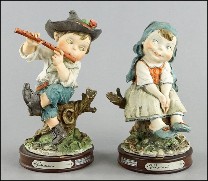TWO 1981 GIUSEPPE ARMANI 'GULLIVER'S WORLD' FIGURES.: TWO 1981 GIUSEPPE ARMANI 'GULLIVER'S WORLD' FIGURES. One depicts a seated peasant girl bearing the incised artist signature, the Capodimonte mark, and is numbered 524/1000. The other depicts a peasant