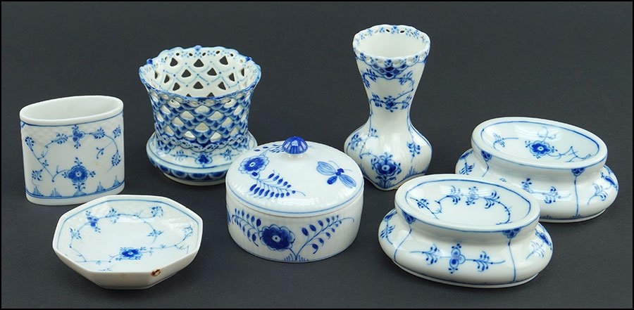 COLLECTION OF ROYAL COPENHAGEN BLUE FLUTED PORCELAIN: COLLECTION OF ROYAL COPENHAGEN BLUE FLUTED PORCELAIN ARTICLES. Five pieces including two plain salt cellars, one plain covered dish, a full lace bud vase, and a full lace toothpick holder. Together wi
