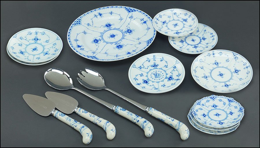 COLLECTION OF ROYAL COPENHAGEN BLUE FLUTED PORCELAIN: COLLECTION OF ROYAL COPENHAGEN BLUE FLUTED PORCELAIN TABLE ARTICLES. Nine plain saucers and three half lace saucers. Together with four matching porcelain and stanless steel serving utensils and anoth
