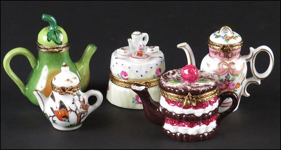 GROUP OF FIVE LIMOGES FRANCE PORCELAIN BOXES.: GROUP OF FIVE LIMOGES FRANCE PORCELAIN BOXES. Of tea party theme. Comprised of a pear form teapot, a cake form teapot, two foliate decorated teapots, and one tea table. All signed "Limoges France" and