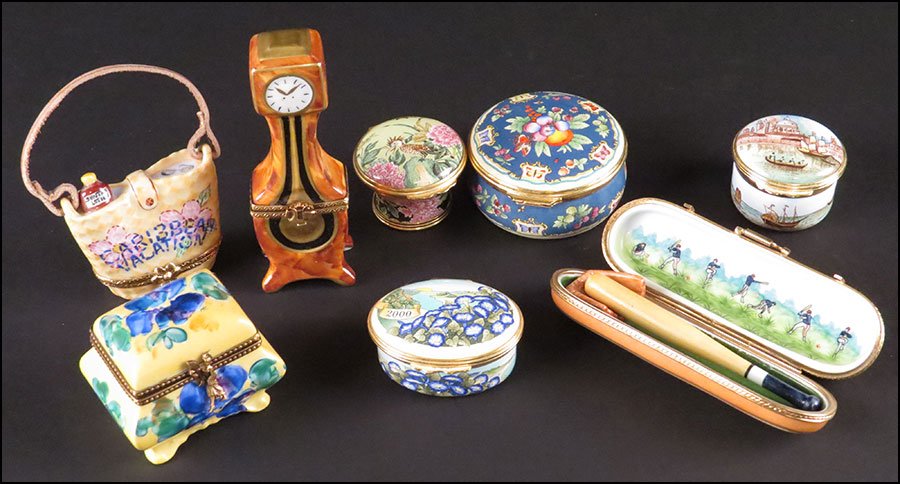 GROUP OF FOUR LIMOGES FRANCE PORCELAIN BOXES.: GROUP OF FOUR LIMOGES FRANCE PORCELAIN BOXES. Comprised of a beach bag with a porcelain sunscreen tube inside, a grandfather clock, a chest, and a baseball case with bat and glove inside. All stamped