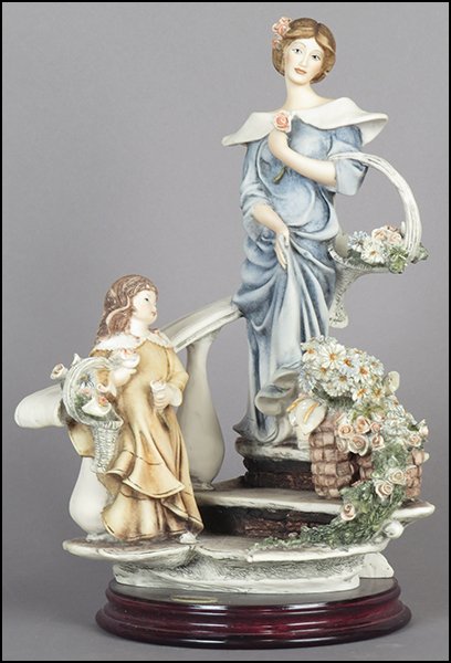 GIUSEPPE ARMANI 'FLOWERS FOR SALE' FIGURAL GROUP.: GIUSEPPE ARMANI 'FLOWERS FOR SALE' FIGURAL GROUP. Depicting a lady and child walking down a set of stairs with flowers. Signed on the sculpture. Copyright Florence 1995. Bearing the Capodimonte 'N' cr