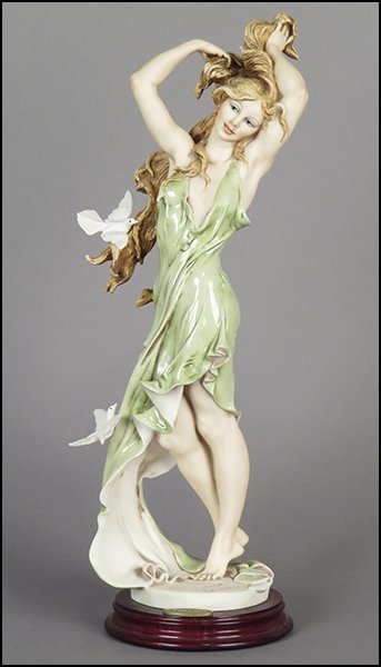 GIUSEPPE ARMANI 'AURORA: GIRL WITH DOVES' FIGURE.: GIUSEPPE ARMANI 'AURORA: GIRL WITH DOVES' FIGURE. Signed on the sculpture. Limited edition no. 3,008/7,500. Copyright Florence 1992. Bearing the Capodimonte 'N' crown stamp. Raised on a wood base (H: