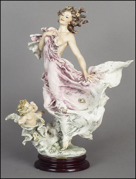 GIUSEPPE ARMANI 'ZEPHYR' FIGURE.: GIUSEPPE ARMANI 'ZEPHYR' FIGURE. Signed on the sculpture. Copyright Florence 1995. Bearing the Capodimonte 'N' crown stamp. Raised on a wood base (H: 1.25'' Diameter: 5.5''). With original box Figure