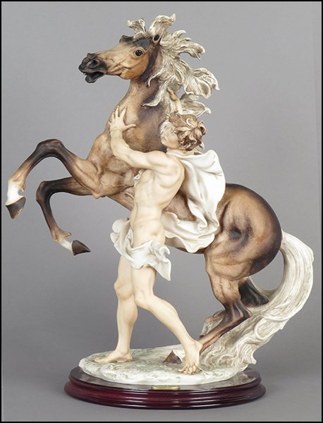 GIUSEPPE ARMANI 'FREEDOM - MAN AND HORSE' FIGURE.: GIUSEPPE ARMANI 'FREEDOM - MAN AND HORSE' FIGURE. Signed on the sculpture. Edition no. 2380/3000. Copyright Florence 1992. Bearing the Capodimonte 'N' crown stamp. Raised on a base (H: 1'' Diameter: 9