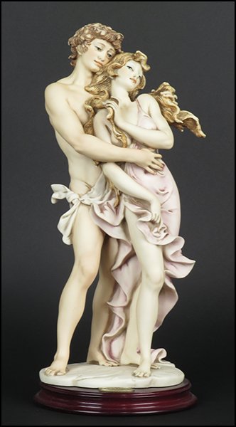 GIUSEPPE ARMANI 'LOVERS' FIGURE.: GIUSEPPE ARMANI 'LOVERS' FIGURE. Signed on the sculpture. Limited Edition no. 2511/3000. Copyright Florence 1992. Bearing the Capodimonte 'N' crown stamp. Raised on a wood base (H: 1'' Diameter: 6'').