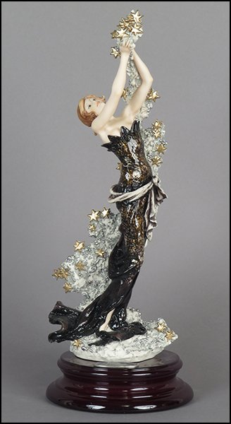 GIUSEPPE ARMANI 'STARDUST' FIGURE.: GIUSEPPE ARMANI 'STARDUST' FIGURE. Signed on the sculpture. Edition 979/5000. Copyright Florence 1998. Bearing the Capodimonte 'N' crown stamp. Raised on a wood base (H: 1.75'' Diameter: 6''). With or