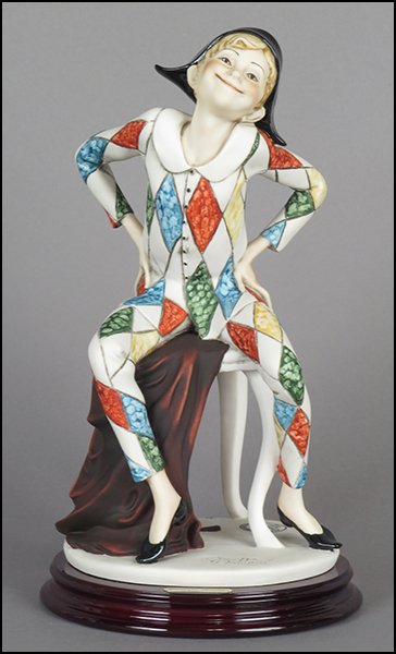 GIUSEPPE ARMANI 'HARLEQUIN' FIGURE.: GIUSEPPE ARMANI 'HARLEQUIN' FIGURE. From the Fifth Anniversary Society Collection 1994. Signed on the sculpture. Copyright Florence 1994. Bearing the Capodimonte 'N' crown stamp. Raised on a base (H: