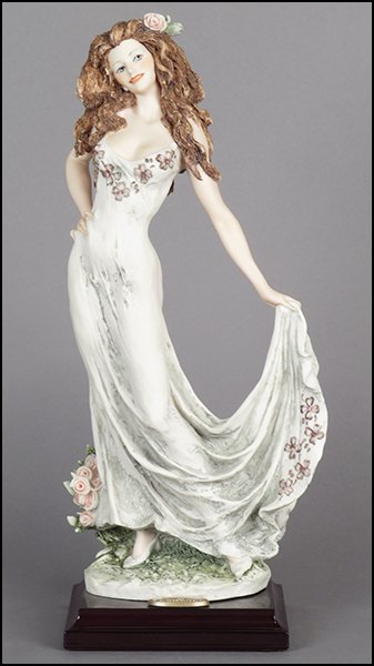 GIUSEPPE ARMANI 'CELEBRATION' FIGURE.: GIUSEPPE ARMANI 'CELEBRATION' FIGURE. From the Member's Society 10th Anniversary series. Signed on the sculpture. Copyright Florence 1998. Bearing the Capodimonte 'N' crown stamp. Raised on a wood bas