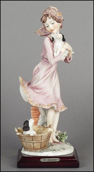 GIUSEPPE ARMANI 'GIRL WITH PUPPIES' FIGURE.: GIUSEPPE ARMANI 'GIRL WITH PUPPIES' FIGURE. Signed on the sculpture. Copyright Florence 1990. Bearing the Capodimonte 'N' crown stamp. Raised on a wood base (.75'' x 4'' x 4''). With original box Figu