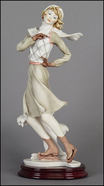 GIUSEPPE ARMANI 'GIRL ON ICE SKATES' FIGURE.: GIUSEPPE ARMANI 'GIRL ON ICE SKATES' FIGURE. Signed on the sculpture. Copyright Florence 1992. Bearing the Capodimonte 'N' crown stamp. Raised on a wood base (.75'' x 5.5'' x 4'') Figure H: 12.25''
