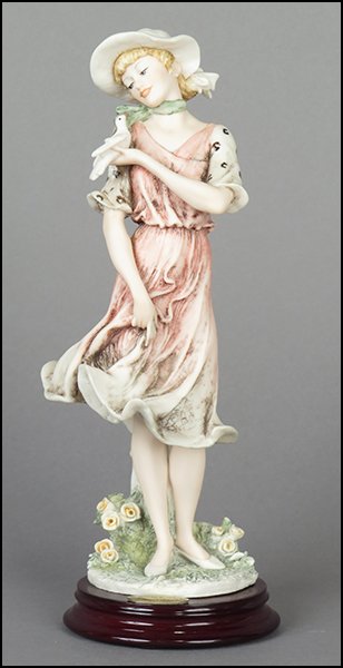 GIUSEPPE ARMANI 'ELISE' FIGURE.: GIUSEPPE ARMANI 'ELISE' FIGURE. Signed on the sculpture. From the Member's Society 1999 Figurine of the Year. Copyright Florence 1997. Bearing the Capodimonte 'N' crown stamp. Raised on a wood base (H