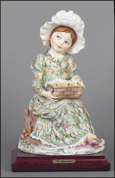 GIUSEPPE ARMANI 'GIRL WITH A BASKET OF BABY CHICKS': GIUSEPPE ARMANI 'GIRL WITH A BASKET OF BABY CHICKS' FIGURE. Signed on the sculpture. Copyright Florence 1982. Bearing the Capodimonte 'N' crown stamp. Raised on a wood base (.75'' x 5'' x 5''). With o