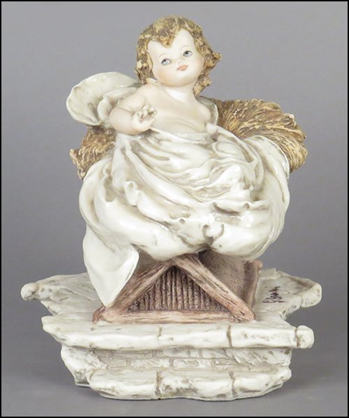 GIUSEPPE ARMANI 'BABY JESUS' FIGURE.: GIUSEPPE ARMANI 'BABY JESUS' FIGURE. Signed on the sculpture. Edition no. 315/1000. Copyright Florence 1994. Bearing the Capodimonte 'N' crown stamp. With original box Figure H: 6.25''