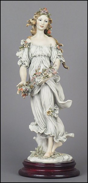 GIUSEPPE ARMANI 'FLORA' FIGURE.: GIUSEPPE ARMANI 'FLORA' FIGURE. Signed on the sculpture. From the Member's Society 1994 Redemption series. Copyright Florence 1993. Bearing the Capodimonte 'N' crown stamp. Raised on a wood base (H: 1