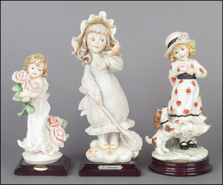 GROUP OF THREE GIUSEPPE ARMANI PORCELAIN FIGURES.: GROUP OF THREE GIUSEPPE ARMANI PORCELAIN FIGURES. Comprised of 'Rosette,' 'It's Mine,' and 'Butterfly Catcher.' All signed on the base. All bear the Capodimonte 'N' crown stamp. Two with their origina