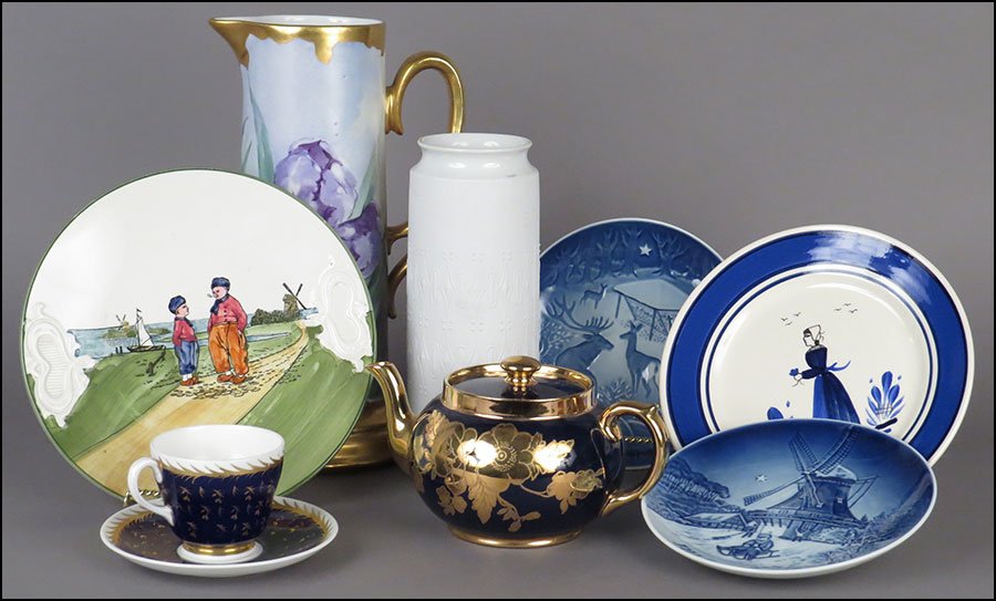 A GROUP OF PORCELAIN DECORATIVE ITEMS.: A GROUP OF PORCELAIN DECORATIVE ITEMS. Comprising a KPM tall vase, a gilt and painted Kellogg pitcher, a hand painted Quimper plate, a Gibson and Sons gilt cobalt teapot, a Wedgwood cup and saucer, a