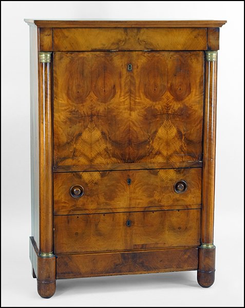 A CONTINENTAL FLAME MAHOGANY A ABBATANT SECRETAIRE.: A CONTINENTAL FLAME MAHOGANY A ABBATANT SECRETAIRE. Comprising a fall front writing surface above two drawers. Sides are formed by two ormolu mounted capitals H: 57.5" W: 40" D: 19"