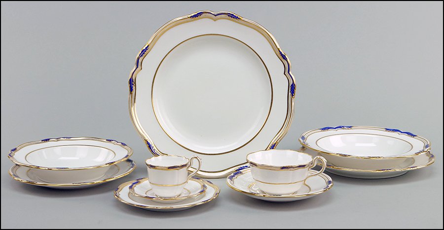 A COPELAND SPODE GILT COBALT PORCELAIN DINNER SERVICE: A COPELAND SPODE GILT COBALT PORCELAIN DINNER SERVICE IN THE SUTHERLAND PATTERN. Comprising nine dinner plates, twelve luncheon plates, twenty-six salad plates, eleven bread plates, nine soup bowls, e