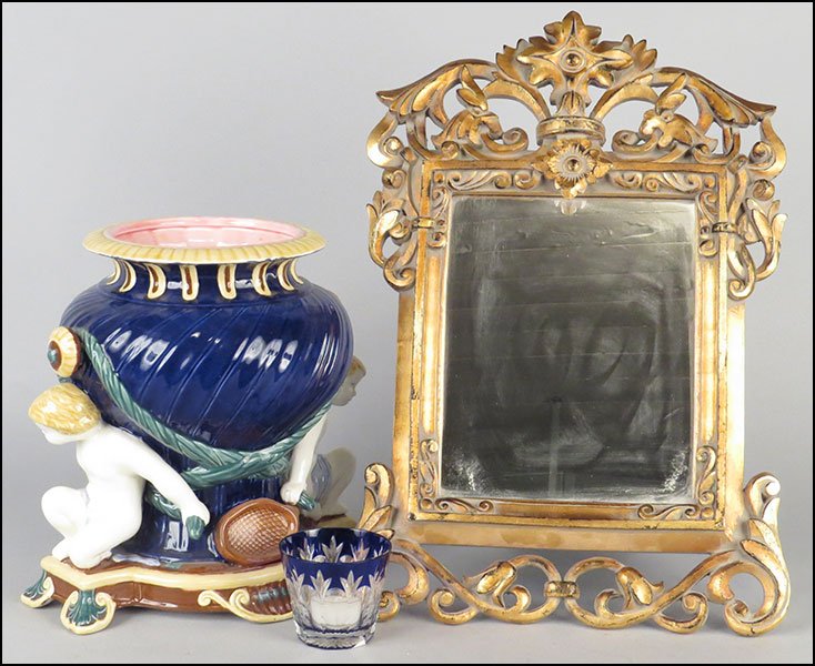 COLLECTION OF DECORATIVE TABLE ARTICLES.: COLLECTION OF DECORATIVE TABLE ARTICLES. Comprised of a Faberge 'Palias Royal' glass votive, in its original box, a gold painted wood framed mirror, and a Zirke Philippines hand-painted figural form u