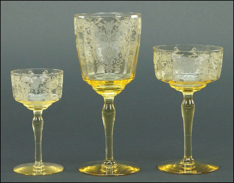 TWENTY-SEVEN PIECE SET OF CANARY DEPRESSION GLASS: TWENTY-SEVEN PIECE SET OF CANARY DEPRESSION GLASS STEMWARE. Bearing etched floral pattern, comprised of nine wine glasses, nine champagne glasses, and nine cordial glasses, all matching Wine: 7.5"