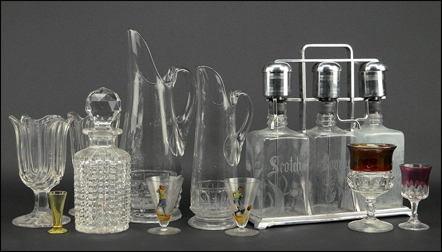 COLLECTION OF CUT AND PRESSED BAR ITEMS.: COLLECTION OF CUT AND PRESSED BAR ITEMS. Comprised of three liquor bottles mounted in a silverplate stand (Scotch, Bourbon, and Rye), a decanter, two pitchers, four stemmed glasses, and three fluted c