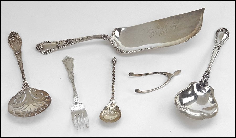 COLLECTION OF STERLING SILVER UTENSILS.: COLLECTION OF STERLING SILVER UTENSILS. Comprised of a crumber, a slotted tomato server, a scalloped edge spoon, a fork, a pair of tongs, and a serving spoon Weight: 12.65 ozt