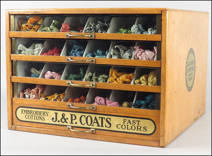 J. & P. COATS' CARVED WOOD FIVE-DRAWER EMBROIDERY CASE.: J. & P. COATS' CARVED WOOD FIVE-DRAWER EMBROIDERY CASE. Four drawers bear glass fronts. With brass fixtures. Includes an assortment of threads 13.5" x 18.5" x 19.5"