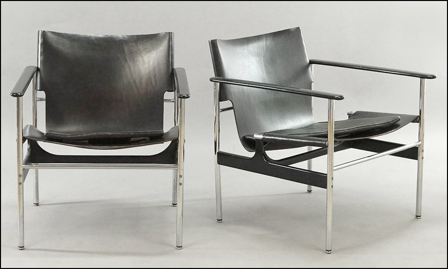 A PAIR OF CHARLES POLLOCK FOR KNOLL LEATHER SLING BACK: A PAIR OF CHARLES POLLOCK FOR KNOLL LEATHER SLING BACK LOUNGE CHAIRS. 28" x 25" x 25" $500/$700 Leather, cast aluminum, and steel. Bearing a separate leather upholstered cushion