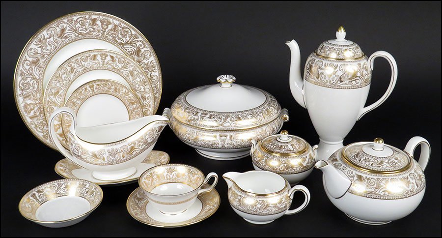 WEDGWOOD PORCELAIN DINNER SERVICE IN THE GOLD: WEDGWOOD PORCELAIN DINNER SERVICE IN THE GOLD FLORENTINE PATTERN. Dinner plate diameter: 10.75" $400/$600 One hundred and fifteen pieces comprising eighteen dinner plates, eighteen salad plates, eight