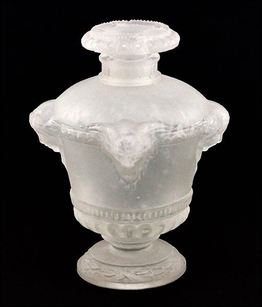 A LALIQUE FROSTED GLASS PERFUME BOTTLE. H: 4" W: 2.25": A LALIQUE FROSTED GLASS PERFUME BOTTLE. H: 4" W: 2.25" D: 2.25" $300/$500 "Bouquet De Faunes". Signed along the side "Guerlain, Paris"