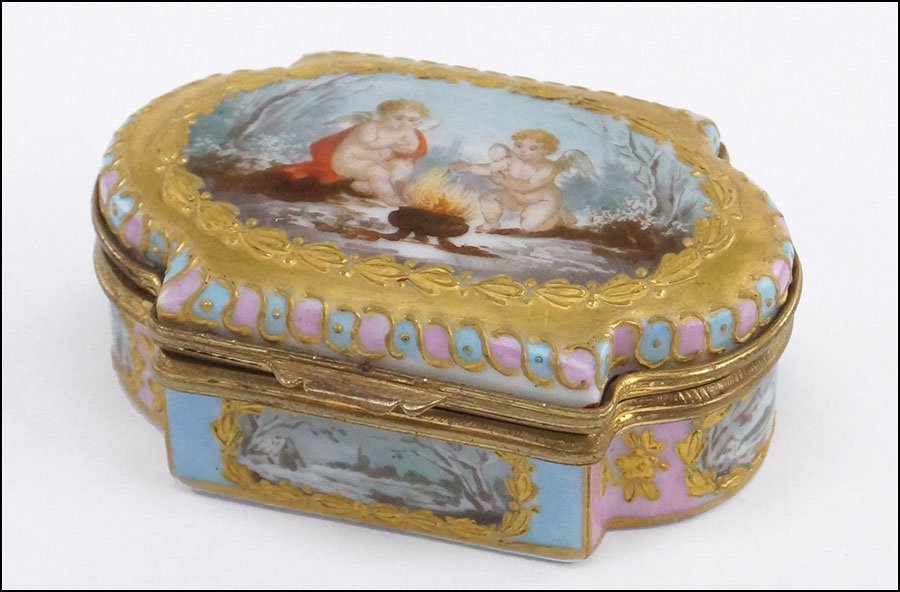 A GERMAN PAINTED AND GILT PORCELAIN BOX. 1" x 2.5" x: A GERMAN PAINTED AND GILT PORCELAIN BOX. 1" x 2.5" x 1.75" $200/$400