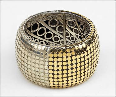 A JOHN HARDY STERLING SILVER AND 18 KARAT YELLOW GOLD: A JOHN HARDY STERLING SILVER AND 18 KARAT YELLOW GOLD WIDE BANGLE BRACELET. 174 grams $200/$400 Provenance: From the Estate of Frances R. Dittmer