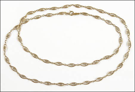 A 14 KARAT YELLOW GOLD FILIGREE LINK NECKLACE. Length:: A 14 KARAT YELLOW GOLD FILIGREE LINK NECKLACE. Length: 25" Wt: 5.5 grams $150/$250