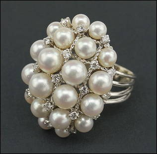 A DIAMOND, CULTURED PEARL AND 14 KARAT WHITE GOLD RING.: A DIAMOND, CULTURED PEARL AND 14 KARAT WHITE GOLD RING. Size: 6.5 Wt: 14.8 grams $500/$700 Comprising 20 cultured pearls (4.5mm - 6mm) and 21 round brilliant diamonds in a checkerboard design