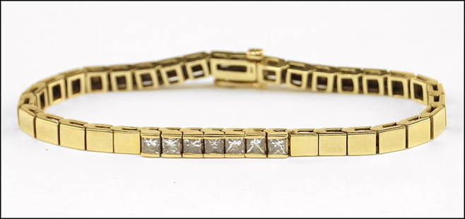 A DIAMOND AND 14 KARAT YELLOW GOLD BRACELET. Length: 7": A DIAMOND AND 14 KARAT YELLOW GOLD BRACELET. Length: 7" Wt: 18.9 grams $400/$600 Comprised of seven princess cut diamonds