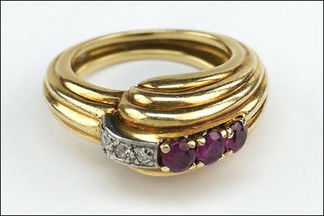 A RETRO RUBY, DIAMOND AND 14 KARAT YELLOW GOLD RING.: A RETRO RUBY, DIAMOND AND 14 KARAT YELLOW GOLD RING. Size: 5 Wt: 8.9 grams $400/$600 Comprising three round rubies and three round diamonds in a grooved setting