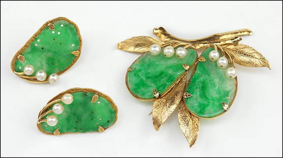 A CARVED JADE, CULTURED PEARL AND 14 KARAT YELLOW GOLD: A CARVED JADE, CULTURED PEARL AND 14 KARAT YELLOW GOLD DEMI-PARURE. Wt: 22.7 grams $1,000/$1,500 Comprising a brooch and a pair of earrings. Pearls are approximately 4.5mm. Brooch is stamped "Ming's"