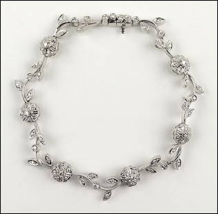 A DIAMOND AND 18 KARAT WHITE GOLD BRACELET. Length:: A DIAMOND AND 18 KARAT WHITE GOLD BRACELET. Length: 7.25" Wt: 15.8 grams $1,300/$1,500 75 round diamonds total approximately 1.03 carats