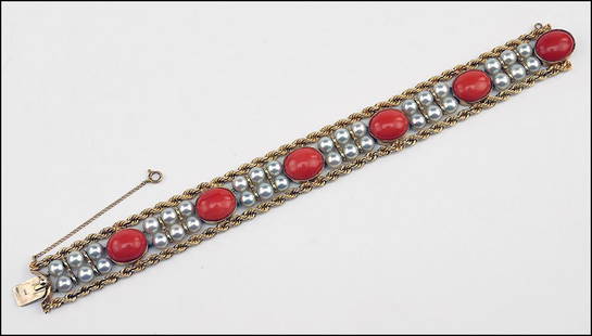 A CORAL, CULTURED PEARL AND 14 KARAT YELLOW GOLD: A CORAL, CULTURED PEARL AND 14 KARAT YELLOW GOLD BRACELET. Length: 7.25" Wt: 38.3 grams $1,000/$1,500 Comprising 36 cultured pearls, six oval cabochon coral and two rows of yellow gold rope. Pearls