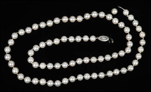 A CULTURED PEARL SINGLE STRAND NECKLACE. Length: 26": A CULTURED PEARL SINGLE STRAND NECKLACE. Length: 26" $200/$300 Pearls are approximately 7mm. With a 10 karat white gold clasp