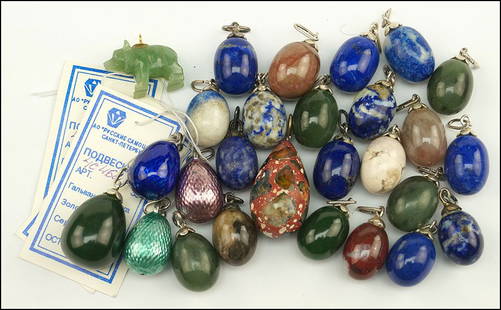 A COLLECTION OF RUSSIAN EGG CHARMS / PENDANTS.: A COLLECTION OF RUSSIAN EGG CHARMS / PENDANTS. $200/$300 Comprised of 25 eggs made of lapis, agate, enamel, sodalite, and other