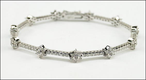 A DIAMOND AND 18 KARAT WHITE GOLD BRACELET. Length: 7": A DIAMOND AND 18 KARAT WHITE GOLD BRACELET. Length: 7" Wt: 13.8 grams $1,000/$1,500 142 round diamonds are G-I color, SI1-SI2 clarity, and total approximately 2.25 carats