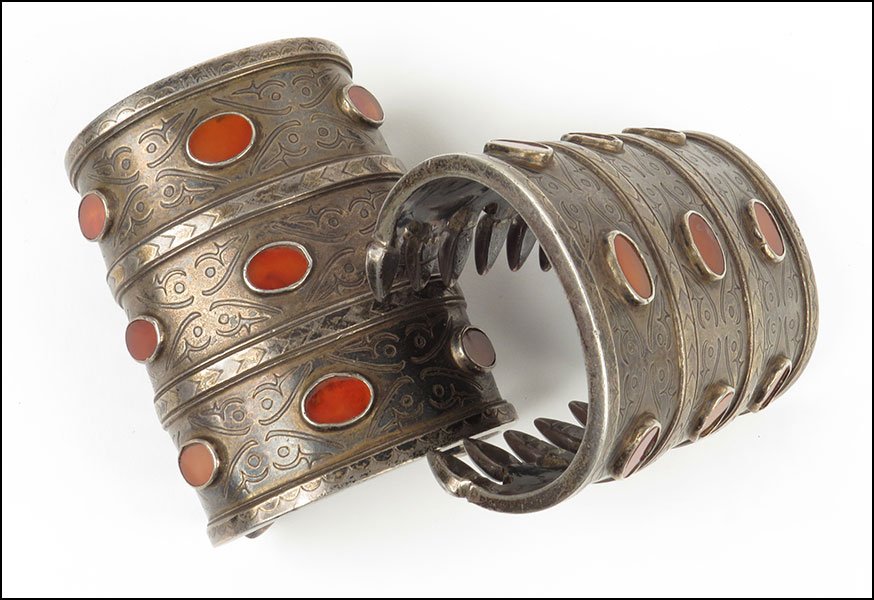 A PAIR OF PERSIAN SILVER AND CARNELIAN BRACELETS.: A PAIR OF PERSIAN SILVER AND CARNELIAN BRACELETS. $400/$600