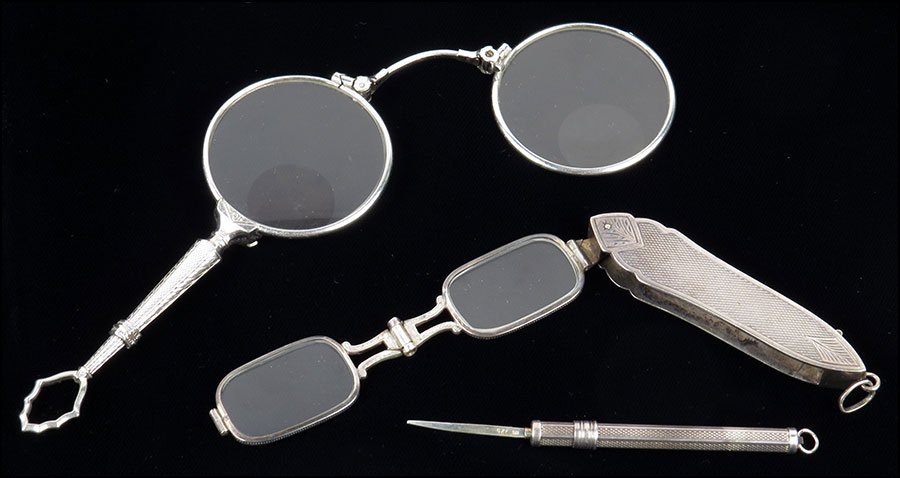 A GERMAN .835 SILVER LORGNETTE. $75/$125 Together with: A GERMAN .835 SILVER LORGNETTE. $75/$125 Together with a silver retractable pen knife, and a silver lorgnette