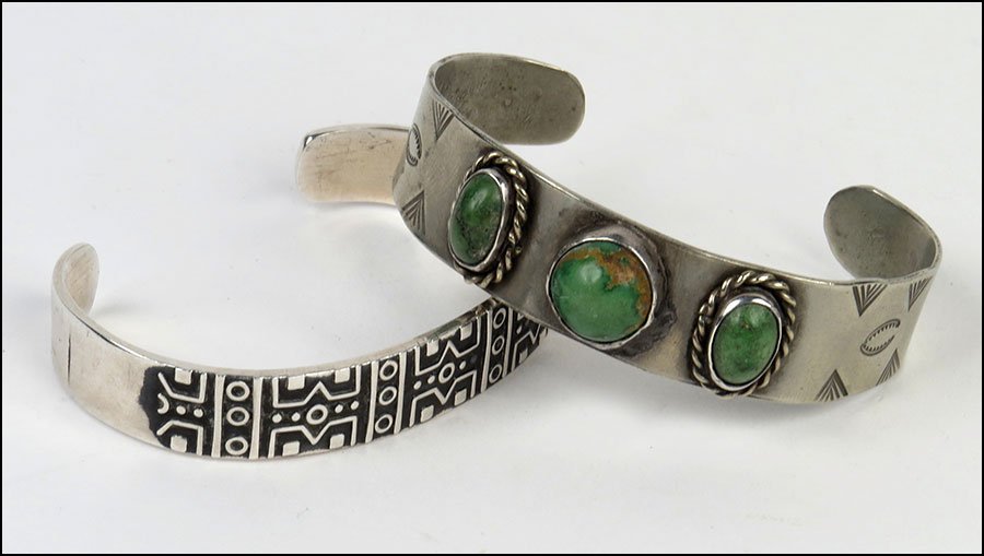 A NATIVE AMERICAN TURQUOISE AND SILVER CUFF BRACELET.: A NATIVE AMERICAN TURQUOISE AND SILVER CUFF BRACELET. $100/$200 Together with a Mexican sterling silver cuff bracelet