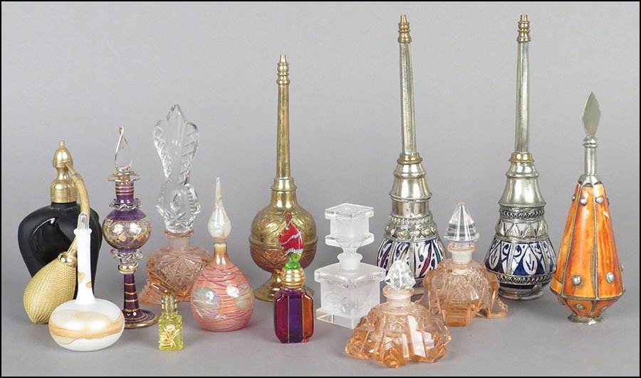 COLLECTION OF SCENTED OIL AND PERFUME BOTTLES. Marcel: COLLECTION OF SCENTED OIL AND PERFUME BOTTLES. Marcel Franck height 5.5" $75/$125 Fourteen bottles including two Moroccan metal and ceramic, one pressed metal, one metal and tiled bone, one Marcel Fra