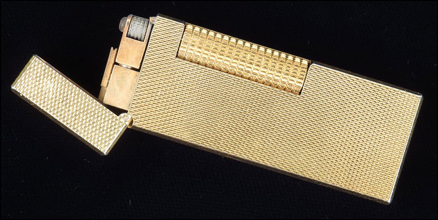 A DUNHILL ROLLAGAS LIGHTER. Lighter: 2.5" $100/$150: A DUNHILL ROLLAGAS LIGHTER. Lighter: 2.5" $100/$150 With original Dunhill box and card